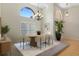 Elegant dining room featuring an oval table, chandelier, arched windows, and modern decor at 9273 Brady St, Spring Hill, FL 34608