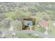 Aerial view of the property within property line, displaying the house, and the surrounding neighborhood at 9397 Merriweather Dr, Weeki Wachee, FL 34613