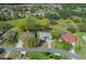 Aerial view showcasing the home's location with mature trees and golf course views, highlighting the surrounding neighborhood at 9397 Merriweather Dr, Weeki Wachee, FL 34613