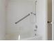 Close up of a bright bathroom bathtub and shower combo with grab bars at 9397 Merriweather Dr, Weeki Wachee, FL 34613