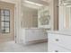 Spacious bathroom with a long vanity and mirror, offering ample counter space at 9397 Merriweather Dr, Weeki Wachee, FL 34613