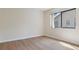Bright bedroom with wood floors and a window at 9397 Merriweather Dr, Weeki Wachee, FL 34613