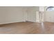Bright foyer featuring double front doors, decorative transom window, and wood flooring at 9397 Merriweather Dr, Weeki Wachee, FL 34613