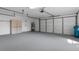 Two car garage with epoxy flooring and plenty of storage space at 9397 Merriweather Dr, Weeki Wachee, FL 34613