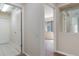 Hallway with tile and wood floors leading to different rooms of the house at 9397 Merriweather Dr, Weeki Wachee, FL 34613
