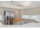Bright kitchen featuring white cabinets, stainless steel appliances and white countertops at 9397 Merriweather Dr, Weeki Wachee, FL 34613