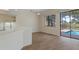Bright living room with sliding glass doors leading to the pool area, enhancing indoor-outdoor living at 9397 Merriweather Dr, Weeki Wachee, FL 34613