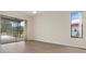Inviting living room with sliding doors offering views of the patio and lush outdoor landscape at 9397 Merriweather Dr, Weeki Wachee, FL 34613