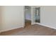View through the doors to the light wood floors and neutral walls of this room at 9397 Merriweather Dr, Weeki Wachee, FL 34613