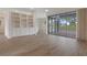 Spacious living room boasts built-in cabinets and a large sliding glass door viewing the pool area at 9397 Merriweather Dr, Weeki Wachee, FL 34613