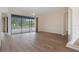 Bright living room with sliding door access to the pool area at 9397 Merriweather Dr, Weeki Wachee, FL 34613