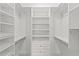 Well-organized walk-in closet with custom shelves and drawers for optimal storage at 9851 Domingo Dr, Brooksville, FL 34601