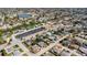 Aerial view of home in a neighborhood with mature trees, near a commercial area at 10245 Regency Park Blvd, Port Richey, FL 34668