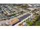 Aerial view of home in a neighborhood with mature trees and nearby parking at 10245 Regency Park Blvd, Port Richey, FL 34668