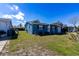 Single story home with a lawn and sidewalk at 10245 Regency Park Blvd, Port Richey, FL 34668