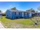 Cozy single-Gathering home with red shutters, well-kept lawn, and charming curb appeal at 10245 Regency Park Blvd, Port Richey, FL 34668
