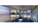 Enclosed Florida room overlooking the backyard at 10245 Regency Park Blvd, Port Richey, FL 34668