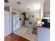 Functional kitchen with white appliances, ample cabinet space, and charming tile floors at 10245 Regency Park Blvd, Port Richey, FL 34668