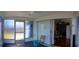 Sunroom with glass sliding doors, carpet, and a ceiling fan, which lets in plenty of natural light at 10245 Regency Park Blvd, Port Richey, FL 34668