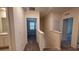 Upstairs hallway leads to bedrooms and bathrooms with neutral walls at 10823 Penny Gale Loop, San Antonio, FL 33576