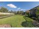 Expansive backyard with lush lawn, secure fencing, and manicured landscaping, creating a private outdoor space at 11383 Callisia Dr, Odessa, FL 33556