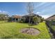 Well-maintained backyard featuring a lush lawn, secure fencing, and mature landscaping for outdoor enjoyment at 11383 Callisia Dr, Odessa, FL 33556