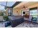 Patio view featuring a hot tub, and comfortable outdoor seating with access to the house at 11383 Callisia Dr, Odessa, FL 33556