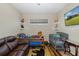 Bedroom with an open window, two shelves with toys, a toddler bed and crib at 11383 Callisia Dr, Odessa, FL 33556
