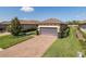 Charming one-story home with a two-car garage, paver driveway and manicured landscaping at 11383 Callisia Dr, Odessa, FL 33556
