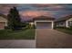 Charming one-story home with a two-car garage, paver driveway and manicured landscaping at 11383 Callisia Dr, Odessa, FL 33556