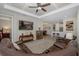 Spacious living room with coffered ceiling open to dining and kitchen areas at 11383 Callisia Dr, Odessa, FL 33556
