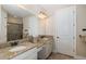 The ensuite bath includes double vanity with granite counters and a walk-in shower at 11383 Callisia Dr, Odessa, FL 33556