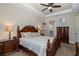 The bedroom has a ceiling fan and a view into the ensuite bathroom at 11383 Callisia Dr, Odessa, FL 33556