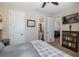 Comfortable main bedroom featuring a large bed, book case, and open access to bathroom and sitting room at 11383 Callisia Dr, Odessa, FL 33556