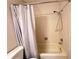 Bright bathroom showcasing a shower-tub combo with a sleek, extendable shower head and neutral tile surround at 12205 Darwood Dr # 12205, Hudson, FL 34667