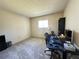 Bedroom with a large window, carpeting, and a desk with computer setup at 12205 Darwood Dr # 12205, Hudson, FL 34667