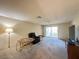 Spacious living room featuring neutral walls, carpeting, and a sliding glass door to the lanai at 12205 Darwood Dr # 12205, Hudson, FL 34667