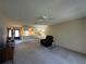 Open living room layout with easy access to the kitchen and plenty of natural light at 12205 Darwood Dr # 12205, Hudson, FL 34667
