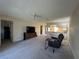 Comfortable living room with neutral carpet, a ceiling fan, and open layout at 12205 Darwood Dr # 12205, Hudson, FL 34667