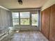 Enclosed sun room with tile flooring and natural light; perfect spot to relax and enjoy the outdoors at 12205 Darwood Dr # 12205, Hudson, FL 34667
