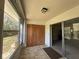 Sun room with closet, tile floor and lots of light streaming into home through big sliding glass doors at 12205 Darwood Dr # 12205, Hudson, FL 34667