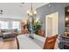 Dining area next to the living room, with modern light fixture at 12279 Penfield St, Spring Hill, FL 34609