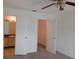 Bedroom features a bathroom and closet visible through open doors for an easy transition at 12401 Joel Ct, Tampa, FL 33612