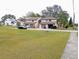 Two-story townhouses with neutral exteriors, garages, and green lawns at 12401 Joel Ct, Tampa, FL 33612