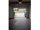 View from the garage highlighting the home's driveway and front yard at 12401 Joel Ct, Tampa, FL 33612