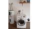 Laundry area with white washing machine, and water heater at 12401 Joel Ct, Tampa, FL 33612