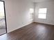 Living room with new floors and access to outside at 12401 Joel Ct, Tampa, FL 33612