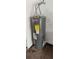 A Rheem Performance water heater featuring flexible water pipes stands against the wall at 12401 Joel Ct, Tampa, FL 33612