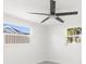 Bedroom featuring a modern ceiling fan and bright windows at 13726 Michelle Ave, Hudson, FL 34667