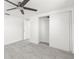 Bedroom with tiled floors and a large closet at 13726 Michelle Ave, Hudson, FL 34667